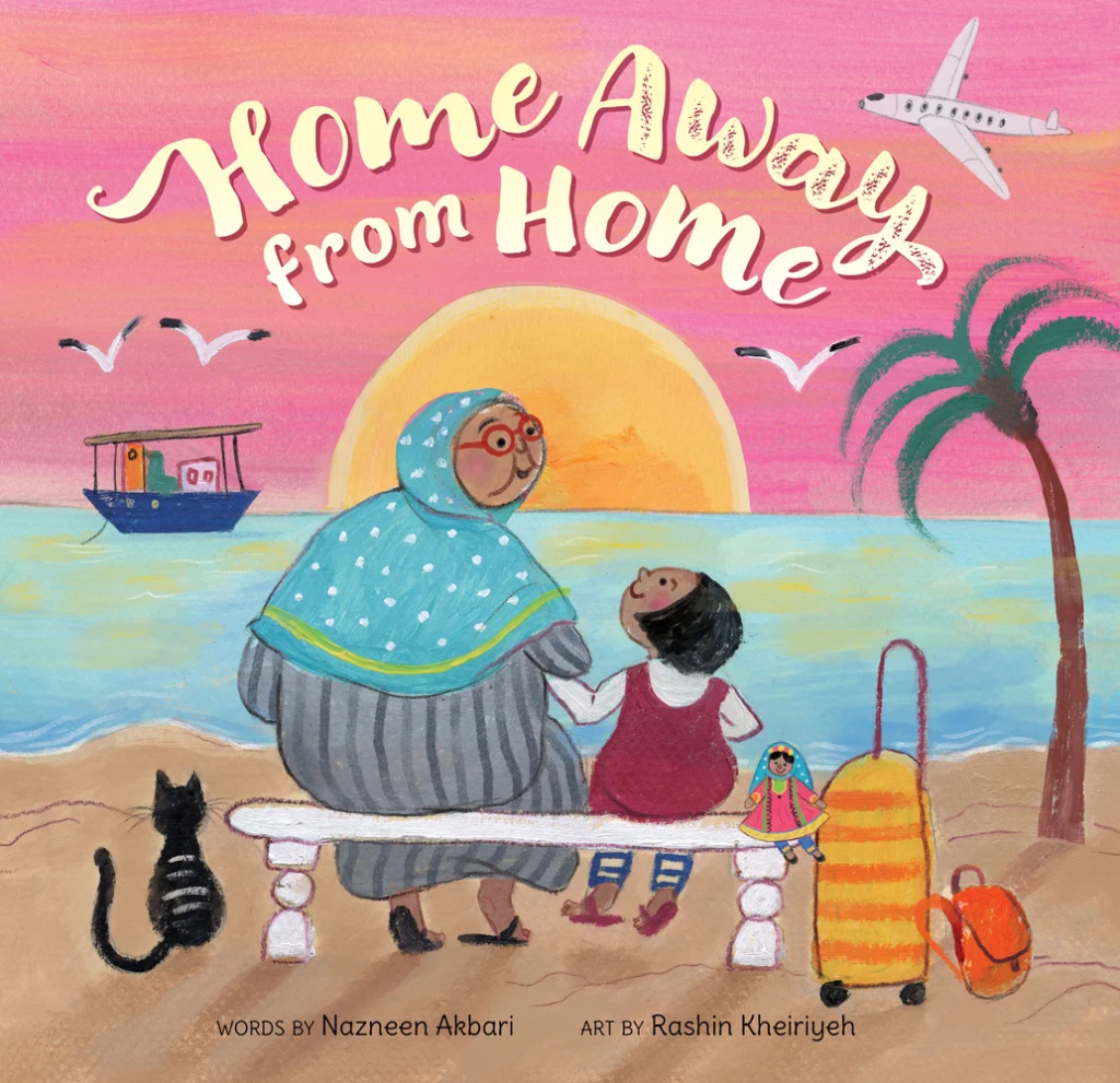 Book cover for Home Away from Home by Nazneen Akbari, illustrated by Rashin Kheiriyeh. A grandmother and granddaughter sit together on a bench looking at the sea in Oman as the sun sets. A boat floats on the water, seagulls and a plane are in the sky. A black cat sits near them and the girl's luggage and doll are with them.